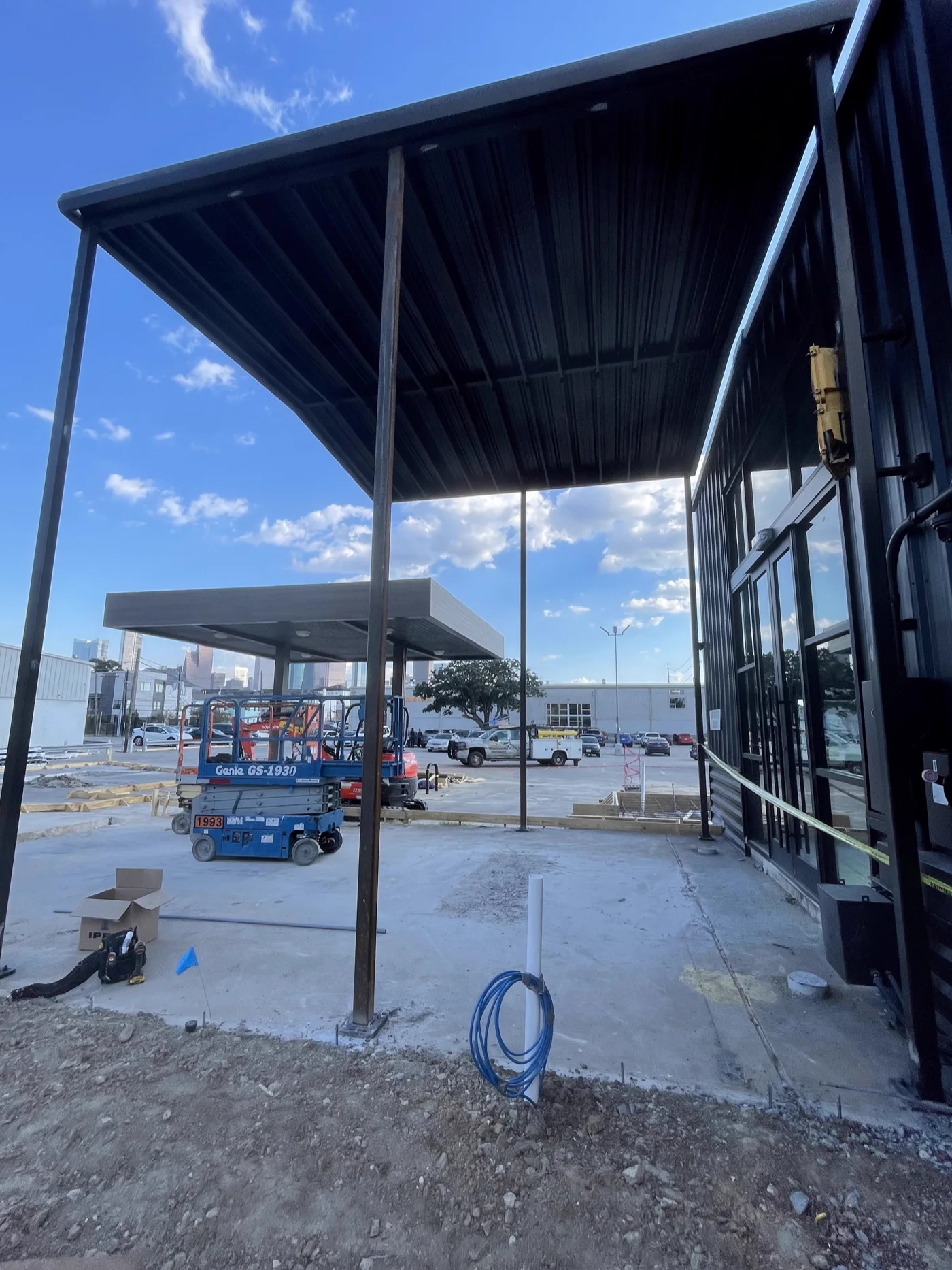canopy-entry.webp Steel canopy carried on slender columns over an entry walkway