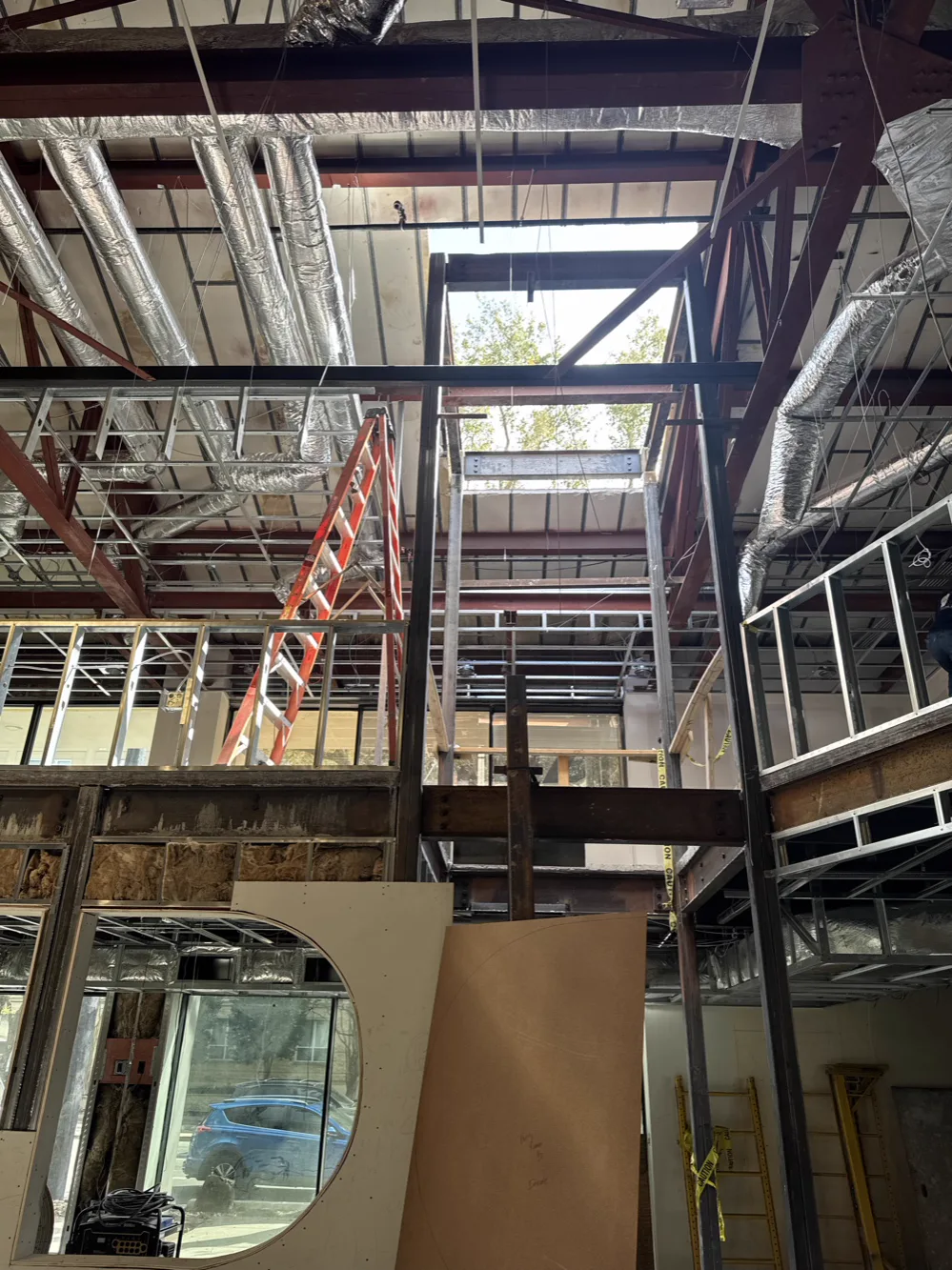 Structural steel columns and beams set in a double-height interior