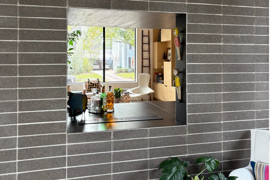 Steel-lined pass-through opening framed into a masonry wall at the 2510 Dryden residence