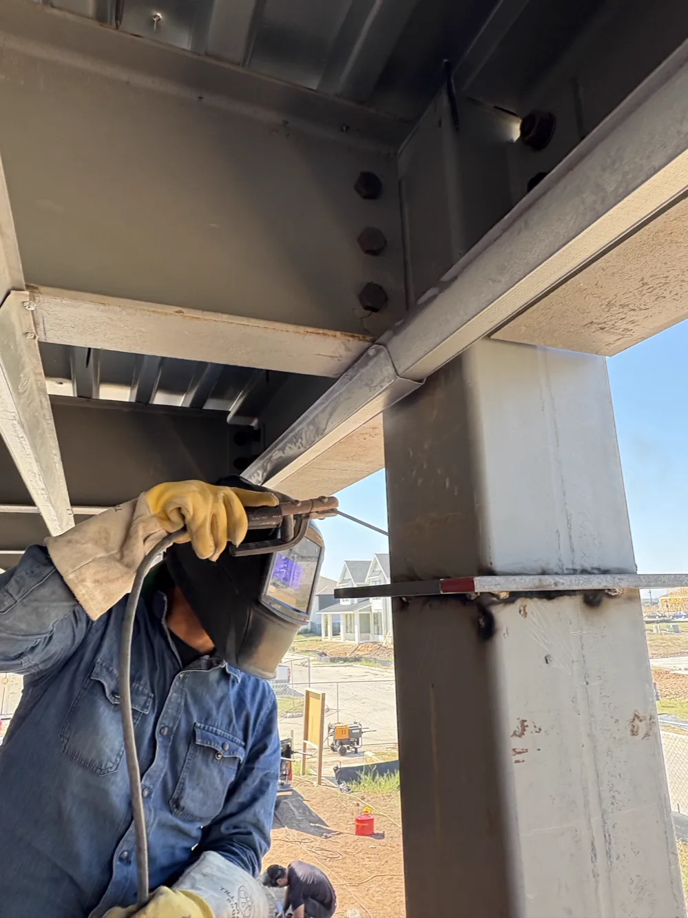A Texas Outlaw Welding welder making a beam-to-column connection